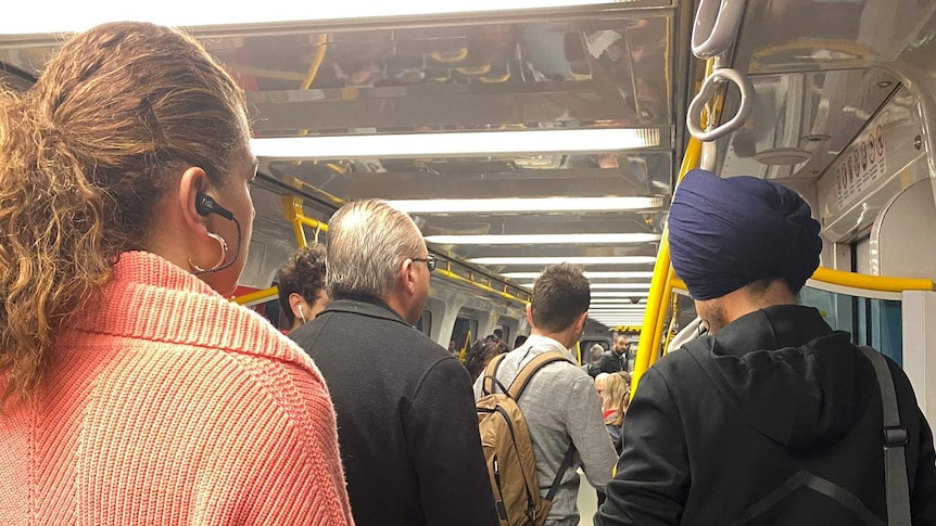People standing inside a train