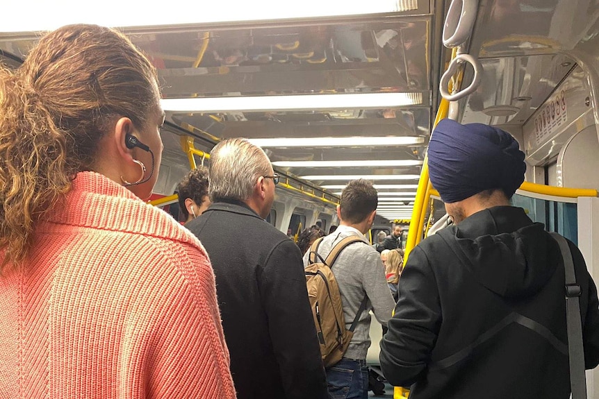 People standing inside a train