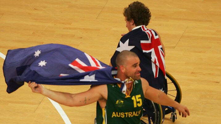 Brad Ness celebrates Australia's gold medal win in the wheelchair basketball.
