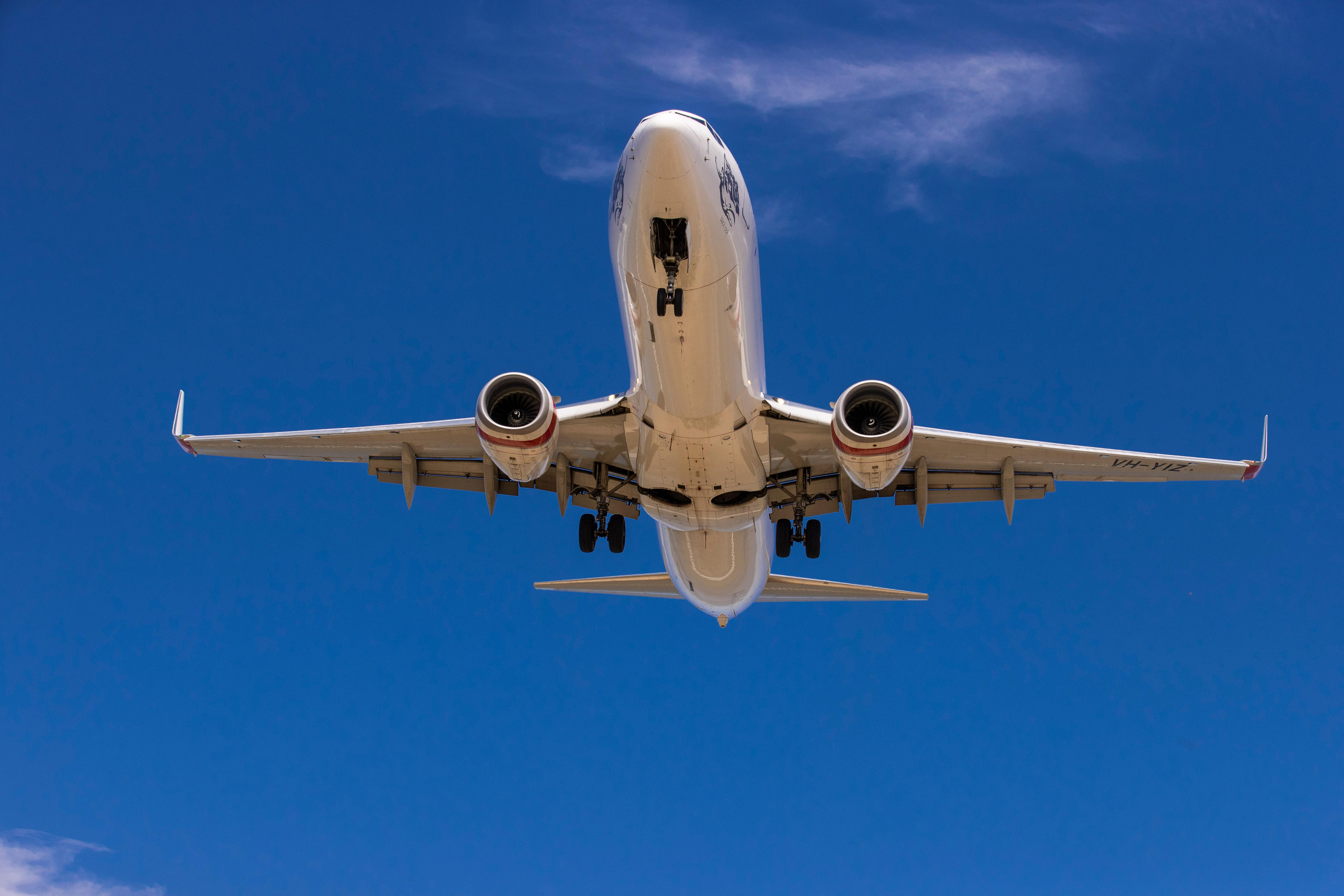 A plane flying in a blue sky.
