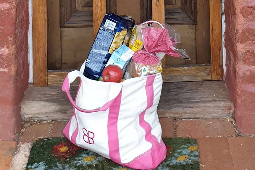 bag of shopping left at front door