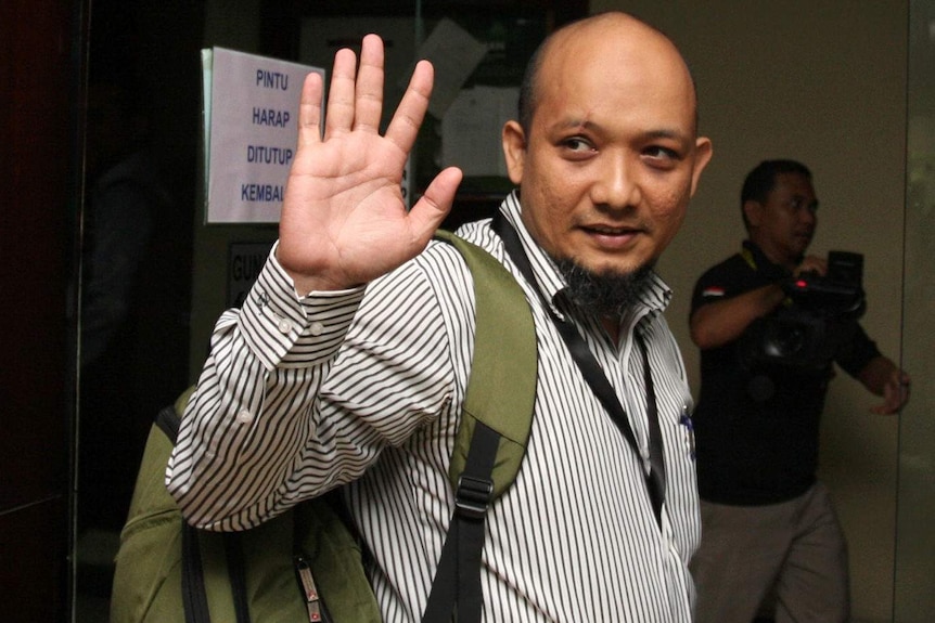Indonesian corruption investigator Novel Baswedan waves to a camera. Photo taken before the acid attack that damaged his eyes.