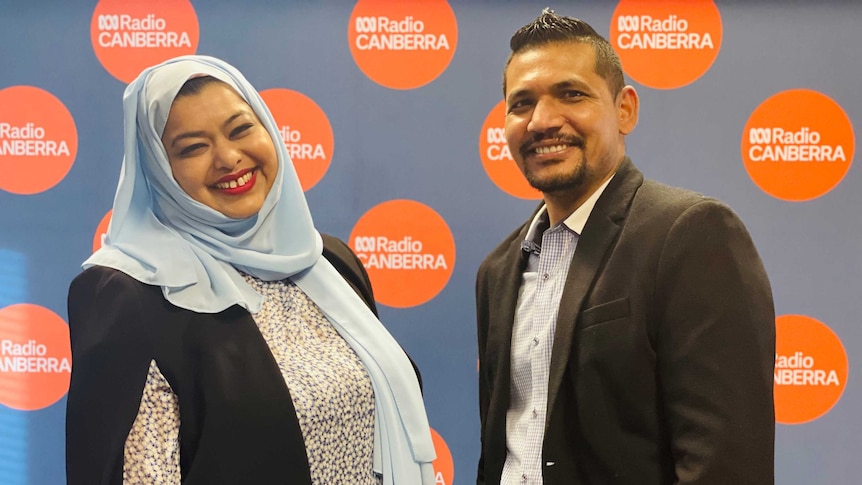 Nazia Ahmed and Nazrul Islam stand in the ABC Canberra studio.