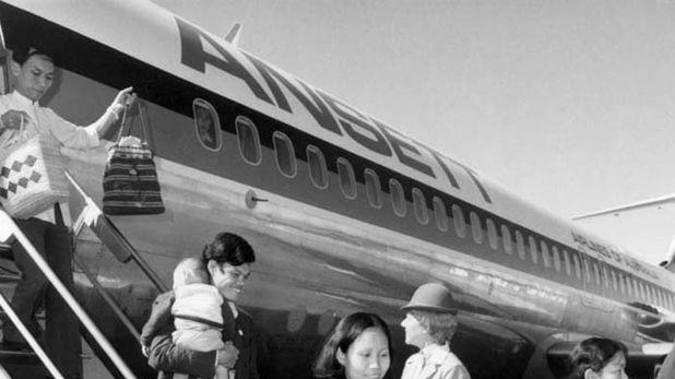 Vietnamese refugees arrive at Canberra airport from camps in South-East Asia, 1979.