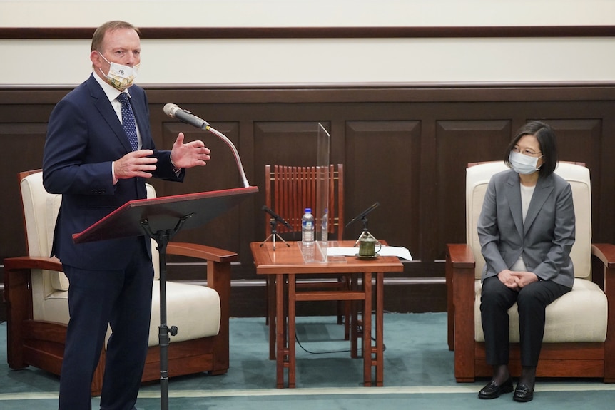 Former prime minister Tony Abbott speaks at an event next to Taiwan's president Tsai Ing-wen, October 2021.