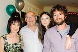 Nicola Trotman with her mum, dad and brother at a party