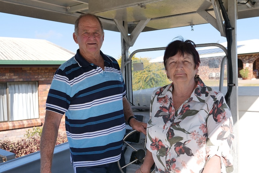 Commercial fishing operators Greg and Zan Sichter on board their boat, outside their Sarina home.