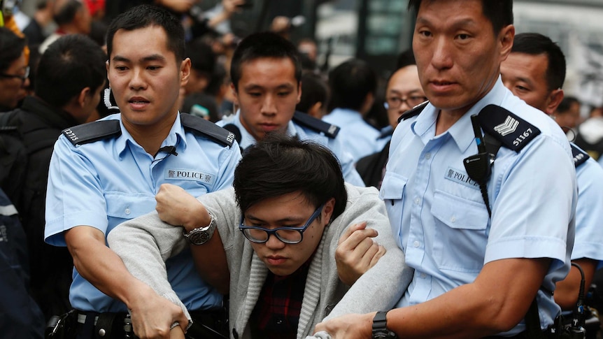 Hong Kong protesters taken away.jpg
