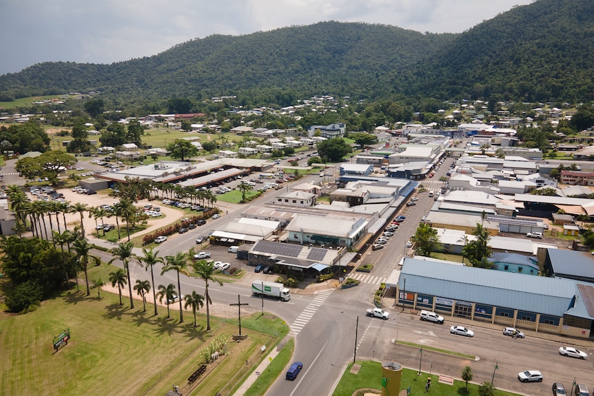 aerial view of small town main street with hills in background 