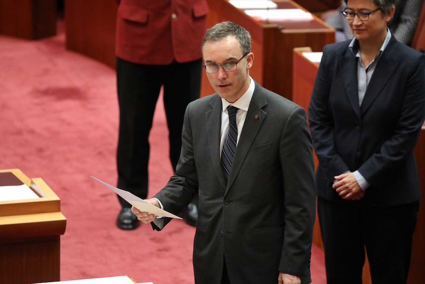 Independent South Australian Senator Tim Storer is being sworn in. Penny Wong is in the background.