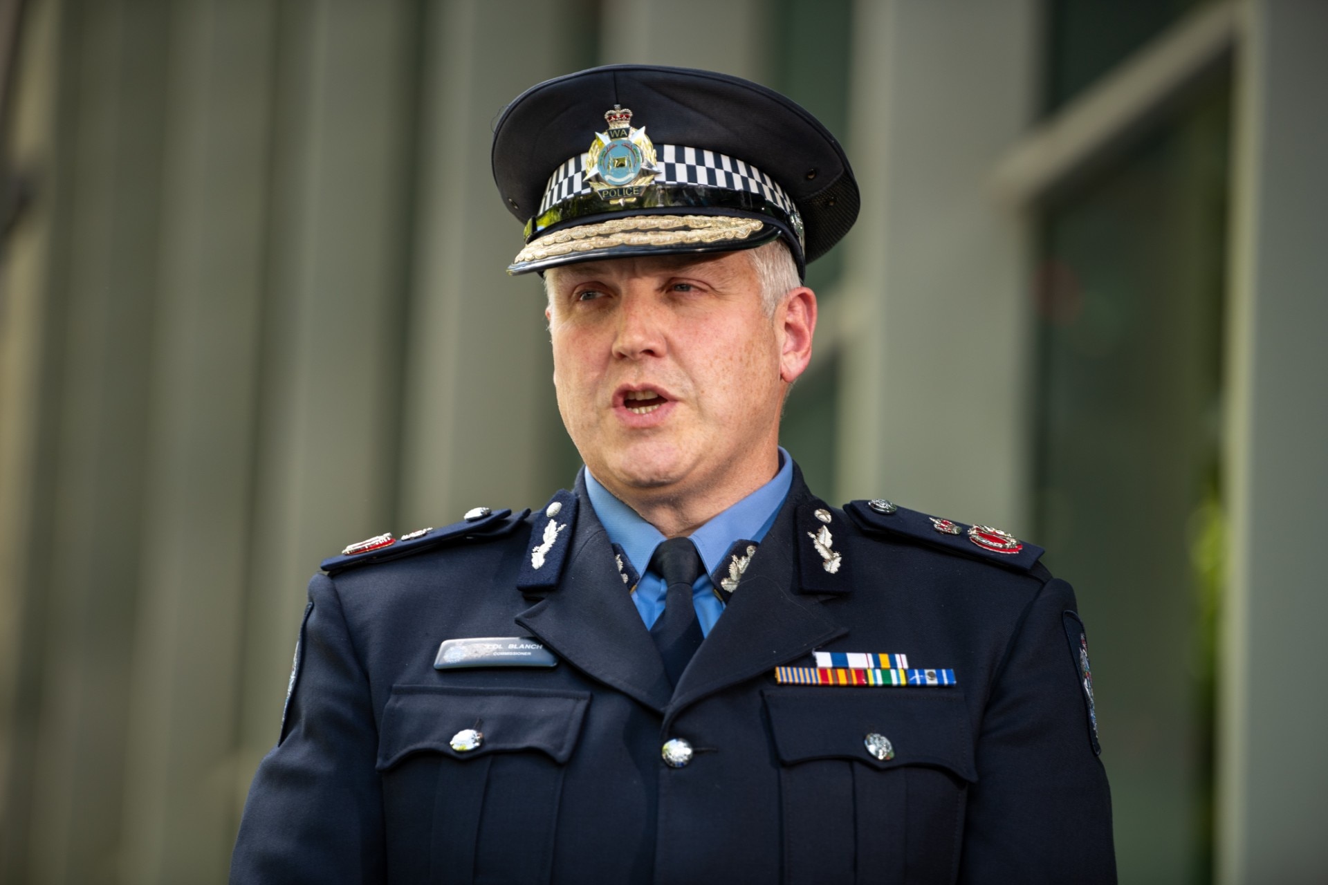 WA Police Commissioner Col Blanch speaks to reporters in full police uniform.