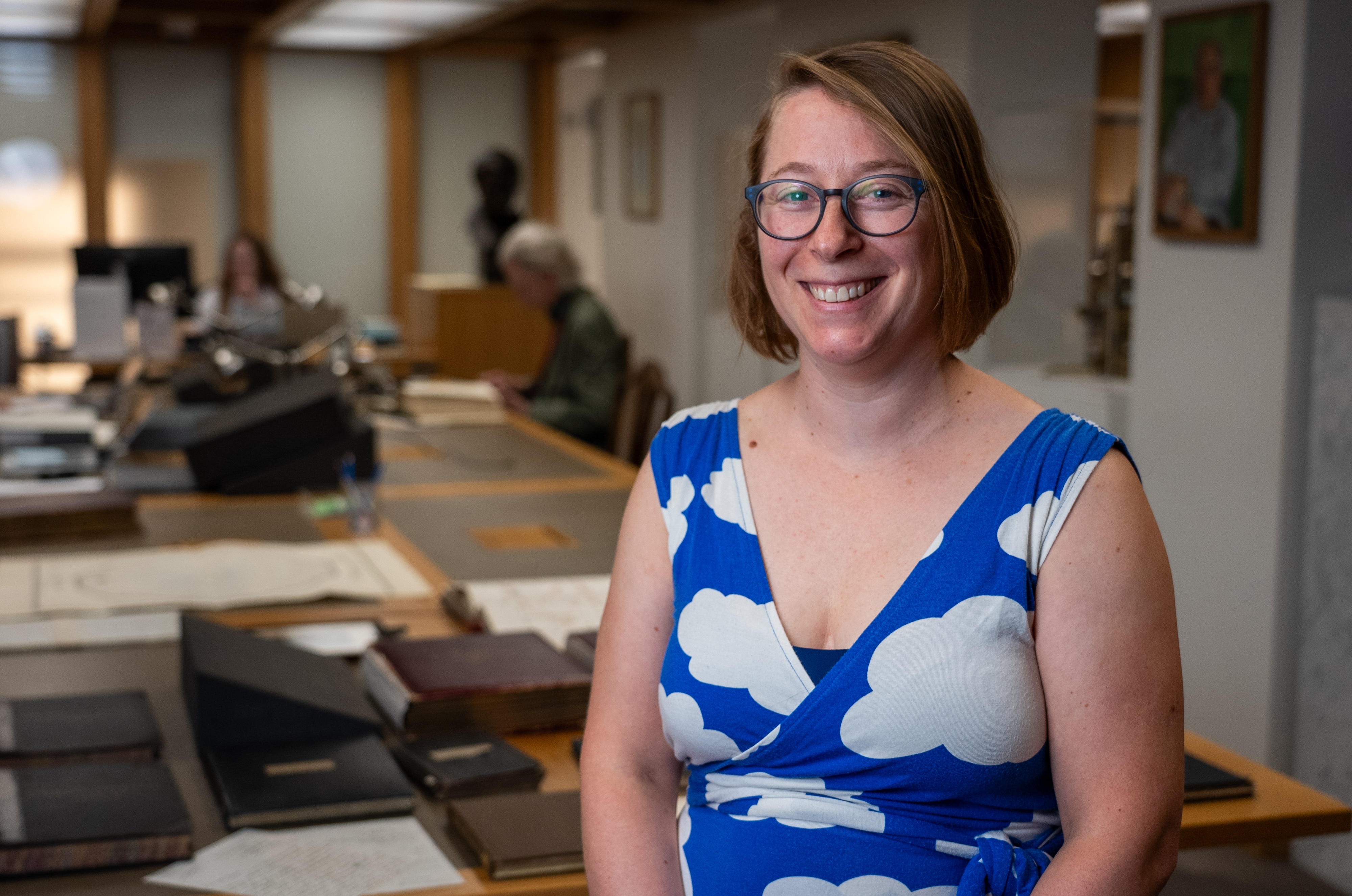 Louisiane Ferlier smiles while standing inside the Royal Society in London. 