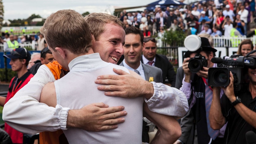 Nathan and Tommy Berry celebrate a race win