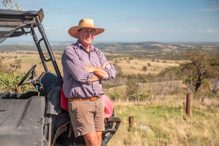 Wool grower Brent Finlay leaning against an ATV on his farm west of Warwick, March 2023.