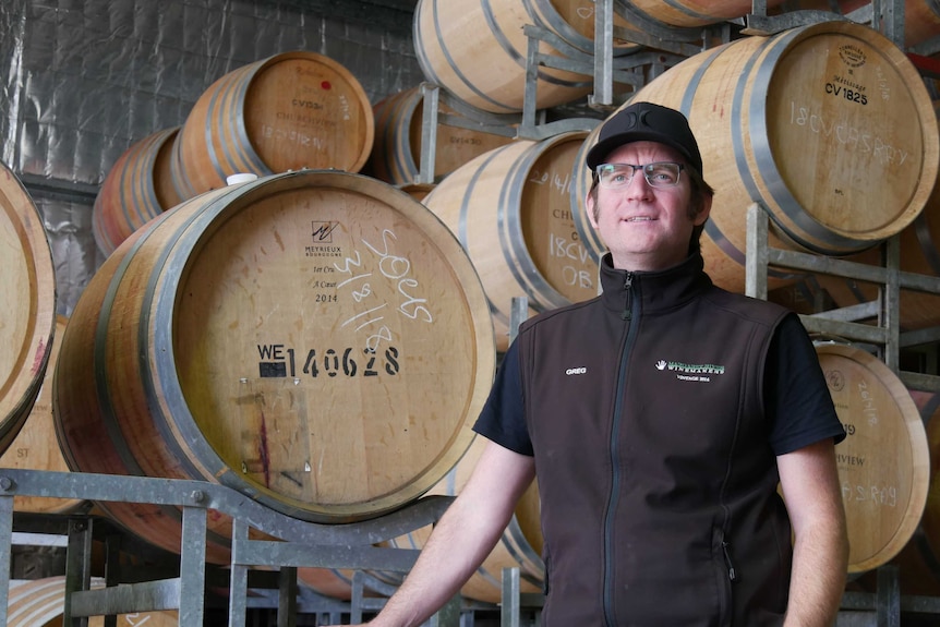 Winemaker Greg Garnish stands by barrels at Margaret River winery