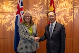 DFAT secretary Jan Adams shakes hands with Ma Zhaoxu, China's vice minister for foreign affairs.