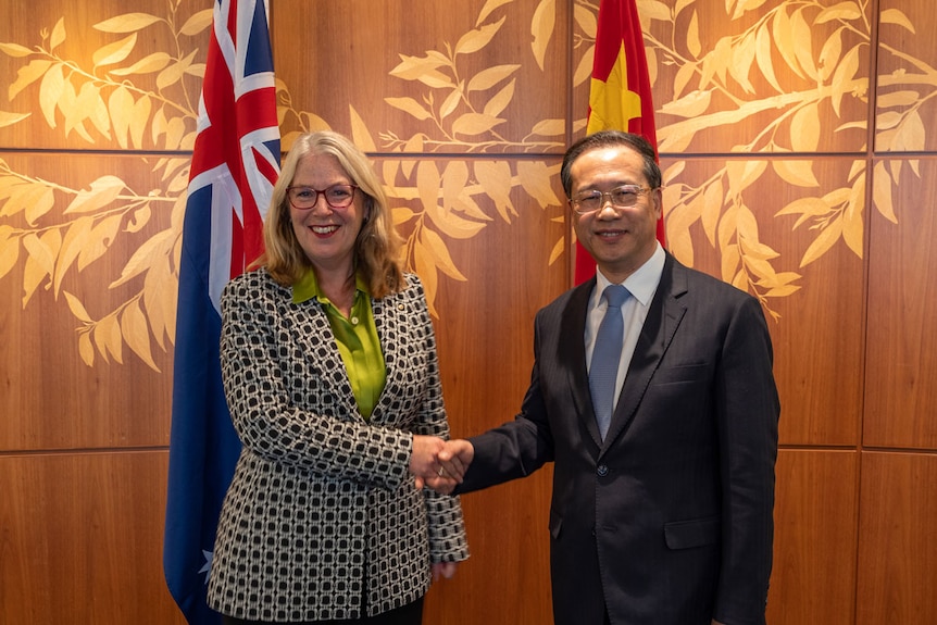DFAT secretary Jan Adams shakes hands with Ma Zhaoxu, China's vice minister for foreign affairs.