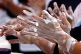 Schoolchildren wash their hands