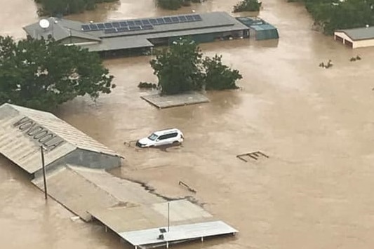 Cattle station buildings in flood