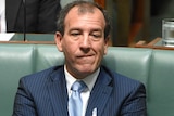 Special Minister of State Mal Brough listens during Question Time at Parliament House in Canberra.