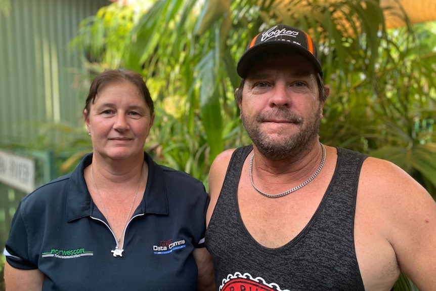 Kylie and Jason Sherwood outside their home