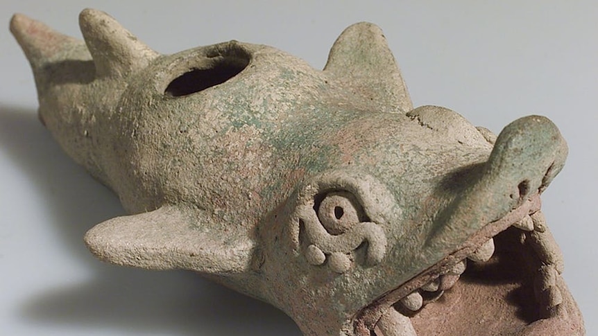 A clay Mayan vessel of a shark with a man in its mouth, circa AD 1450-1550.