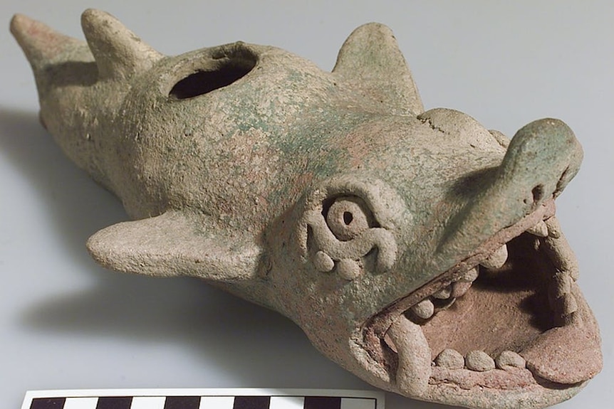 A clay Mayan vessel of a shark with a man in its mouth, circa AD 1450-1550.