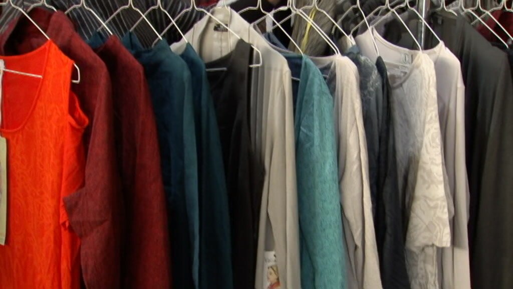 Clothes on hangers at a clothing shop