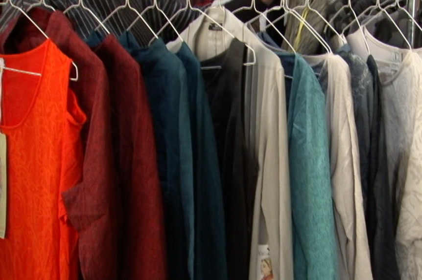 Clothes on hangers at a clothing shop