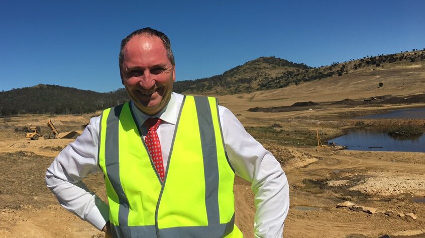 Barnaby Joyce wearing a bright yellow safety vest on a work stie in March 2017.