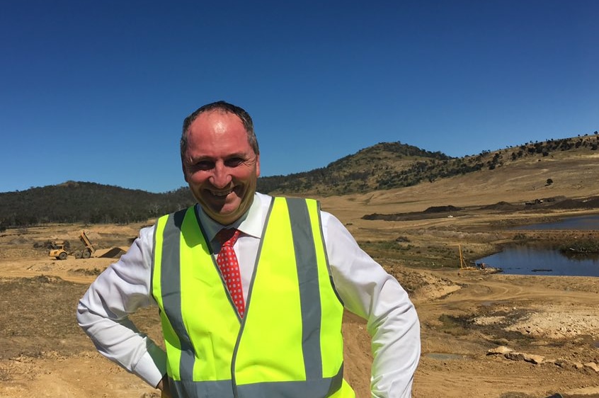 Barnaby Joyce wearing a bright yellow safety vest on a work stie in March 2017.