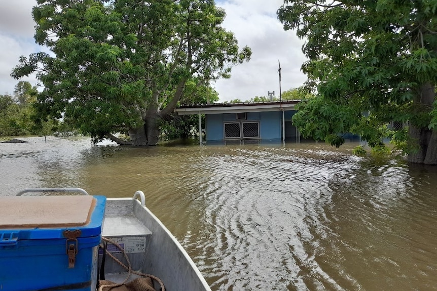 A blue house with flood up to the windows