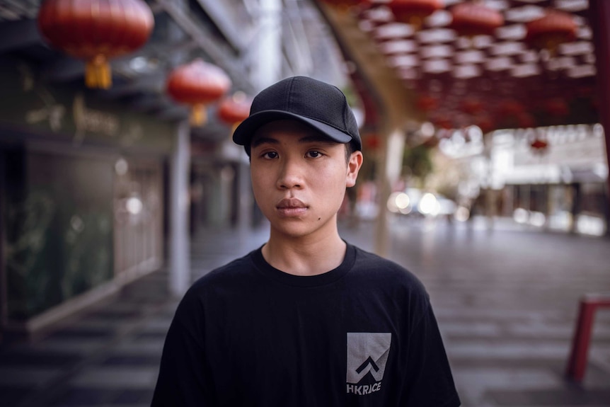 Max Mok stands for a portrait in Brisbane.