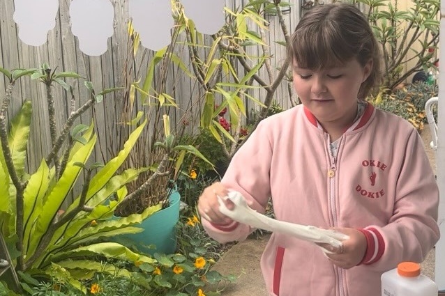 Daisy holding slime.