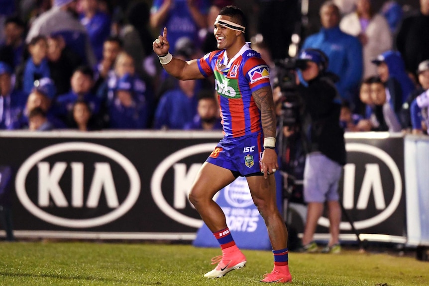 Peter Mata'utia of the Knights celebrates scoring a try against the Bulldogs at Belmore.