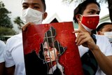 Myanmar citizens hold up a picture of leader Aung San Suu Kyi after the military seized power in a coup in Myanmar.