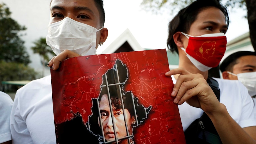 Myanmar citizens hold up a picture of leader Aung San Suu Kyi after the military seized power in a coup in Myanmar.