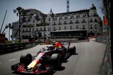 Daniel Ricciardo drives past a grand hotel in Monaco