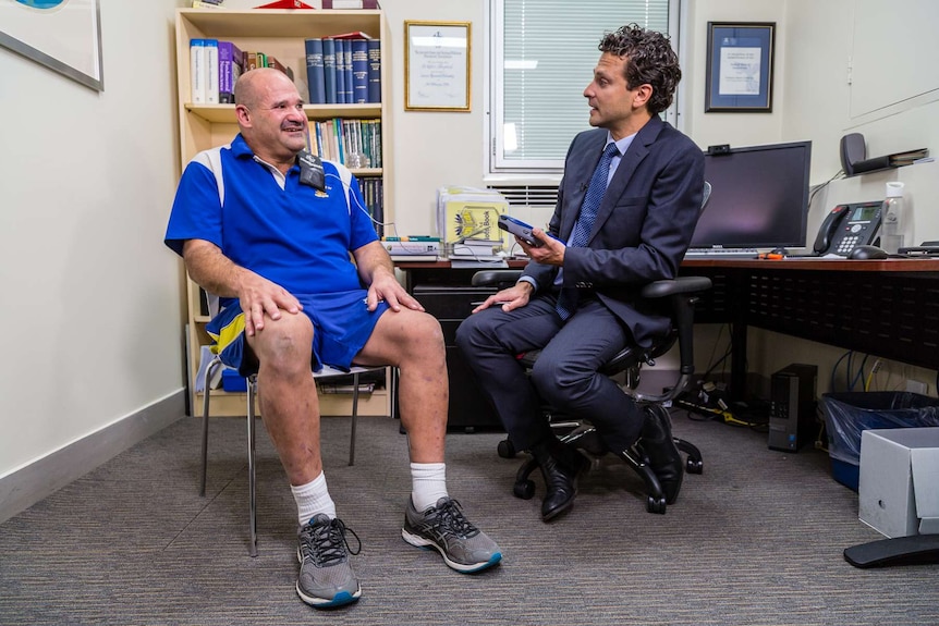 Grant Rowe, a Parkinson's disease sufferer, sits with Dr Wesley Thevathasan at St Vincent's Hospital.