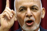 Afghan President Ashraf Ghani raising his finger whilst giving a speech.