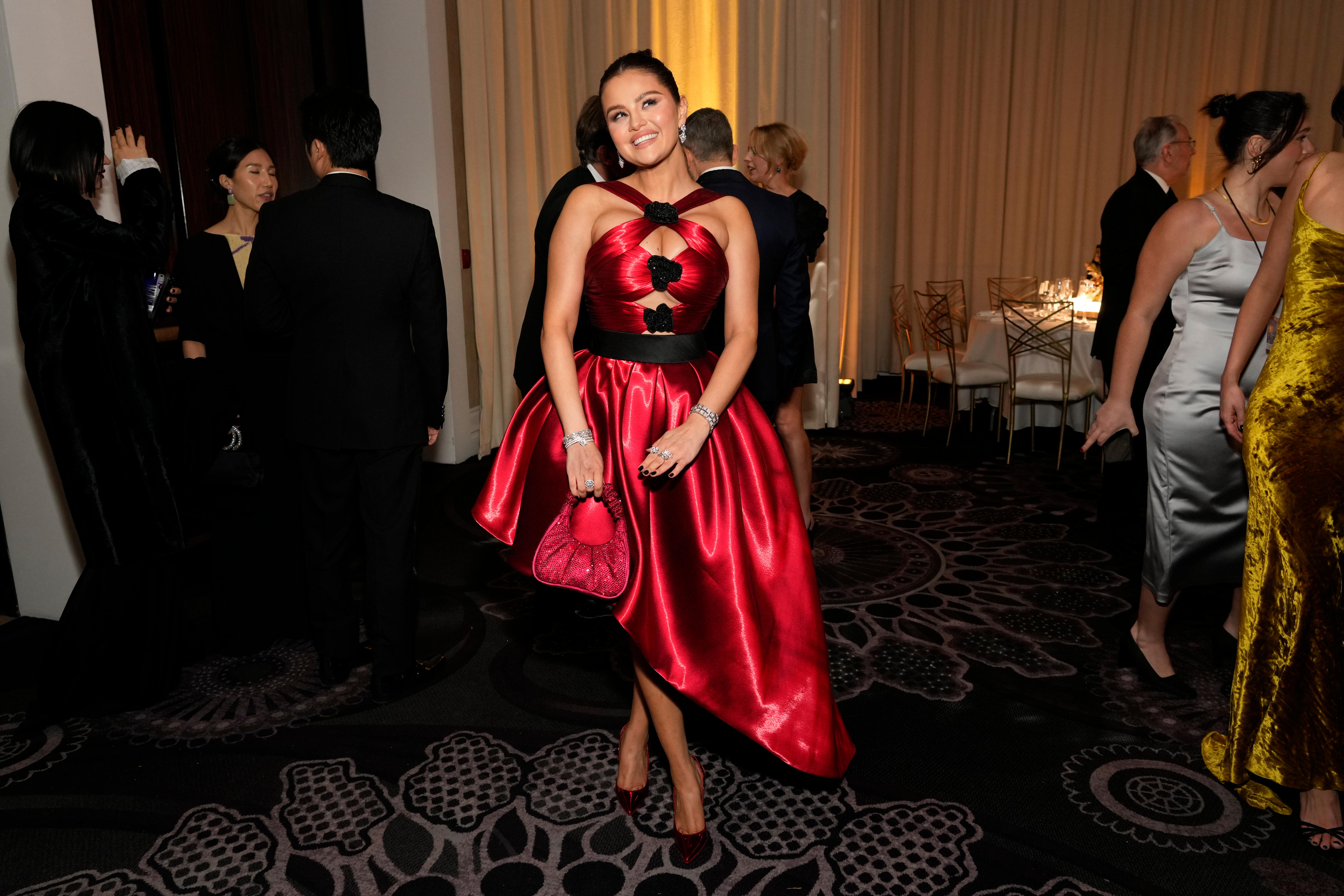 Actress and singer Selena Gomez in a red cut out dress