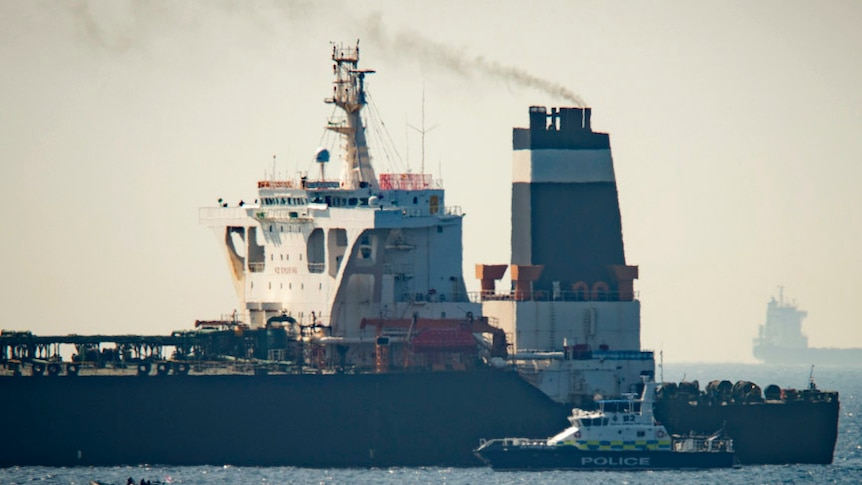 A Royal Marine patrol vessel is seen beside a super tanker in the British territory of Gibraltar.