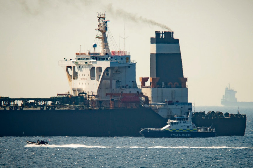 A Royal Marine patrol vessel is seen beside a super tanker in the British territory of Gibraltar.