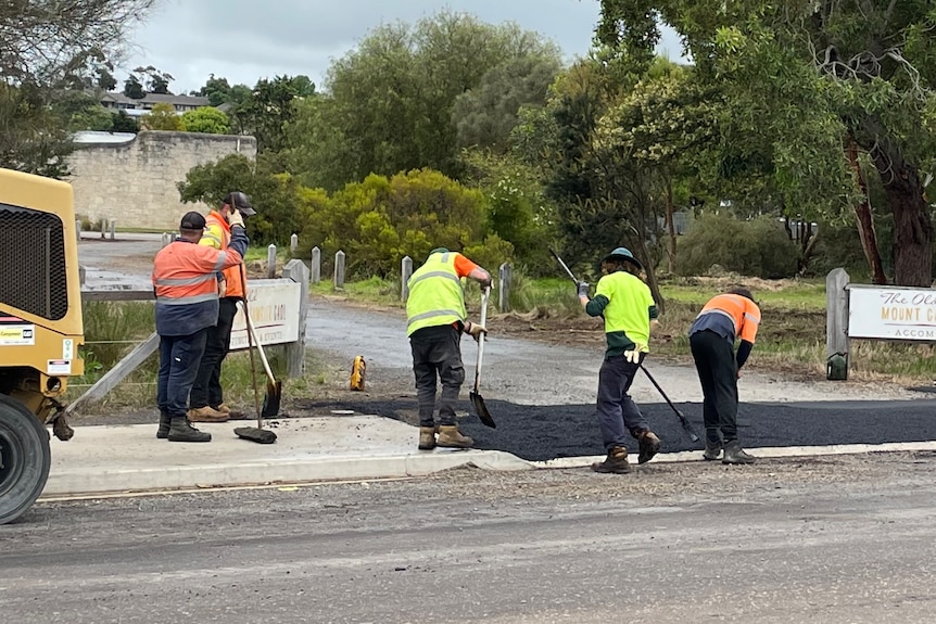 workers doing roadworks for local council