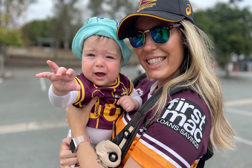 Luka Pajnic and Crystal Barnes wear Broncos merch