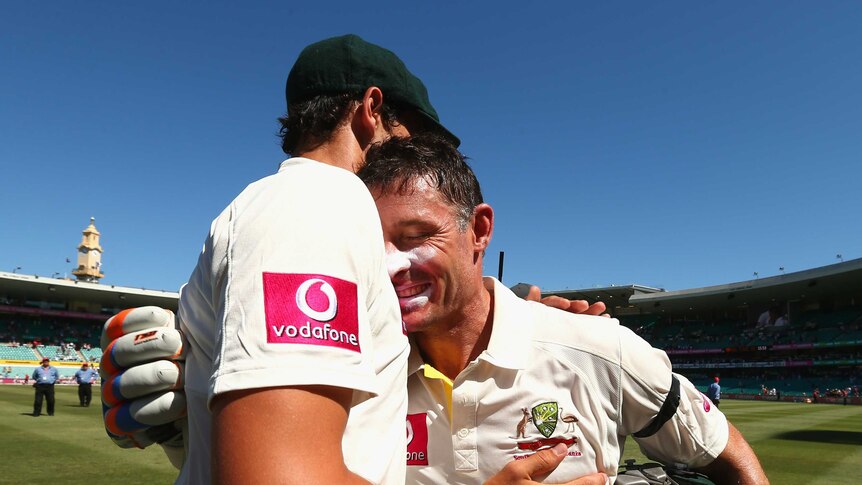 Bowing out a winner ... Michael Hussey is congratulated by Mitchell Starc.