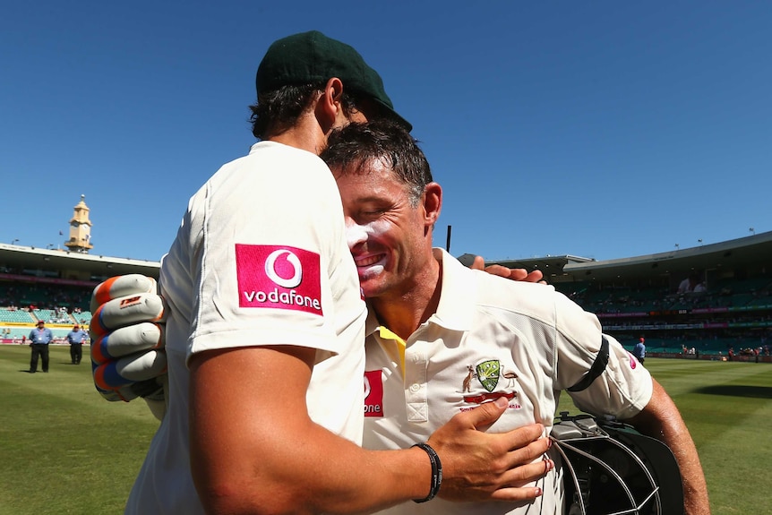 Bowing out a winner ... Michael Hussey is congratulated by Mitchell Starc.
