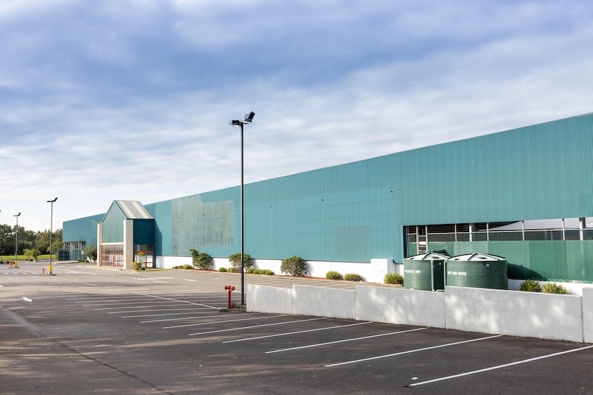 Exterior of a Bunnings store, that has had the logo painted over.