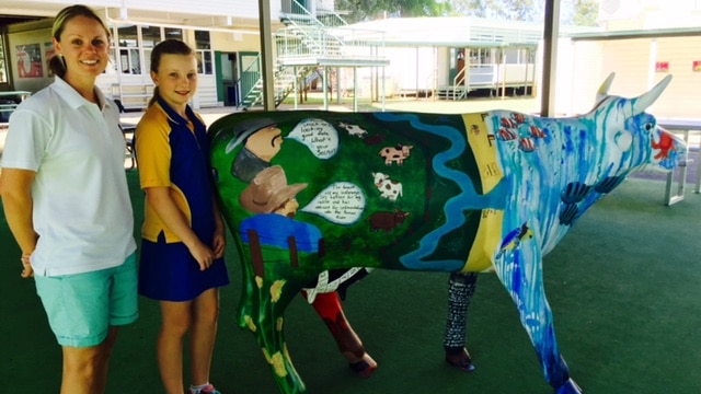 Tambo State School student Selena and teacher Belinda Thompson with Barcco Bella on her farm management side.
