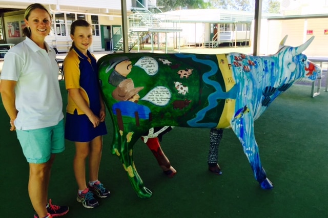 Tambo State School student Selena and teacher Belinda Thompson with Barcco Bella on her farm management side.